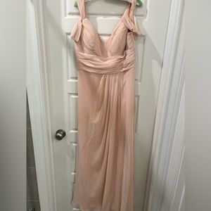 Light pink full length bridesmaid dress with bell sleeves